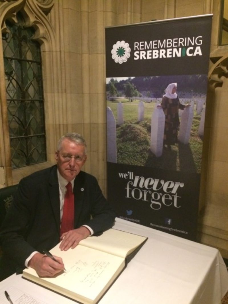 Hilary signing the Srebenica Memorial Book 